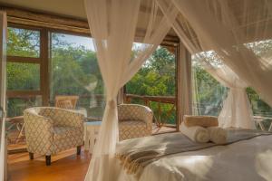 מיטה או מיטות בחדר ב-Panzi Lodge