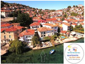 an aerial view of a town with a river and houses at 'By the Lake' Apartments in Ohrid