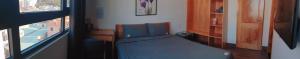 Postel nebo postele na pokoji v ubytování Nếp Apartment Hotel