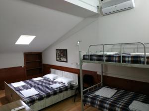 Postel nebo postele na pokoji v ubytování Hostel Portal