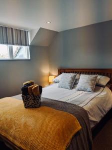 a bedroom with two beds and a window at Lodbourne House B&B in Gillingham