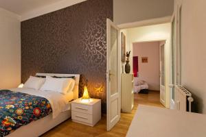 Posteľ alebo postele v izbe v ubytovaní Rome La Sapienza Apartment + 37 fotografií