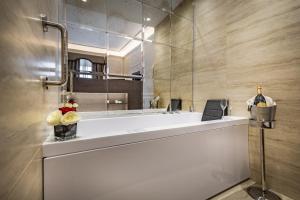 a bathroom with a large white sink and a mirror at Il Rivalta - Place of Charme in Florence +113 photos