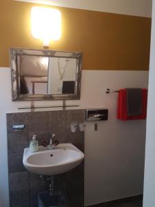 Kupatilo u objektu Garni Giacometti
