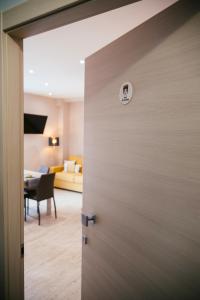a door leading into a room with a bedroom at Le Tre More in Giardini Naxos