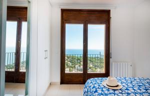 Postel nebo postele na pokoji v ubytování Panorama Costa Brava
