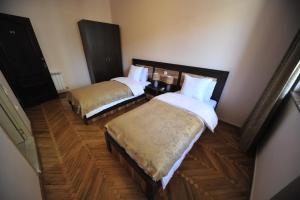 Postel nebo postele na pokoji v ubytování Guest House Batumi Globus