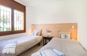 Postel nebo postele na pokoji v ubytování Panorama Costa Brava