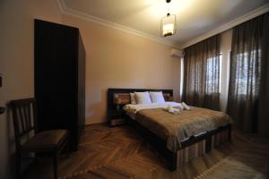 Postel nebo postele na pokoji v ubytování Guest House Batumi Globus