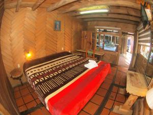 Postel nebo postele na pokoji v ubytování Hotel Cabaña Los Ruiseñores