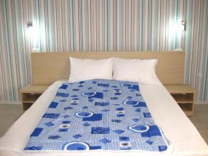 Ένα ή περισσότερα κρεβάτια σε δωμάτιο στο Vila Azul