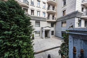 a large apartment building with a large courtyard at Parliament on Rustaveli Studio in Tbilisi City