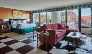 a hotel room with a bed and a couch at Graduate Lincoln in Lincoln