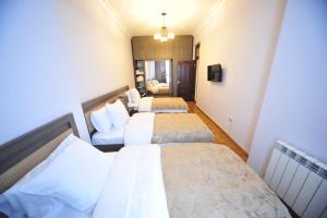 Postel nebo postele na pokoji v ubytování Guest House Batumi Globus
