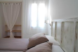 A bed or beds in a room at Es Daus - Formentera Break