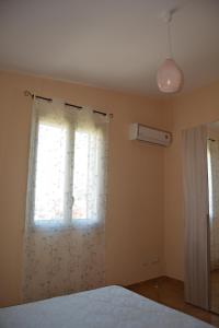 Postel nebo postele na pokoji v ubytování Villa Lu Noto