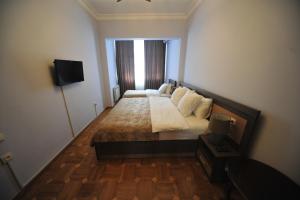 Postel nebo postele na pokoji v ubytování Guest House Batumi Globus