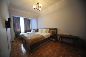 Postel nebo postele na pokoji v ubytování Guest House Batumi Globus