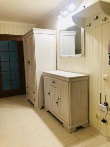 a bathroom with a sink and a mirror at Classic Apartment in Boryspil +11 photos