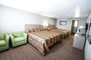 Tempat tidur dalam kamar di Belcaro Motel