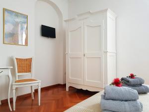 Postel nebo postele na pokoji v ubytování Miglioranzi Rooms