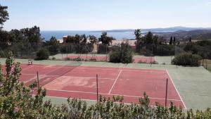 a tennis court with two tennis courts at résidence Bellevue in Roquebrune-sur-Argens