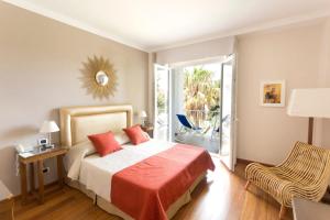 Кровать или кровати в номере Hotel Kalura