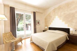 Кровать или кровати в номере Hotel Kalura