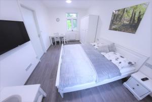 Postel nebo postele na pokoji v ubytování JM Apartments