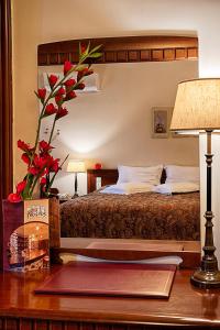 Łóżko lub łóżka w pokoju w obiekcie Hotel Nostos