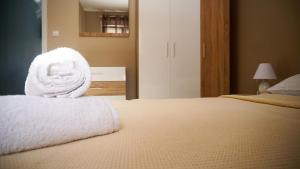 A bed or beds in a room at Stratonikis Apartments