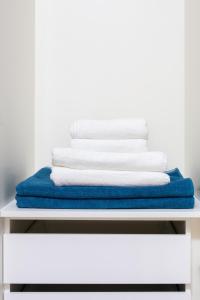 A bed or beds in a room at Rooms & Suites Loft 2H Deluxe Edition Arrecife