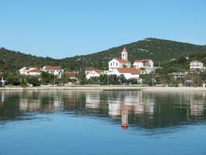 a town on the shore of a body of water at 21 Kosinac GREEN PARADISE in Vinišće +48 photos