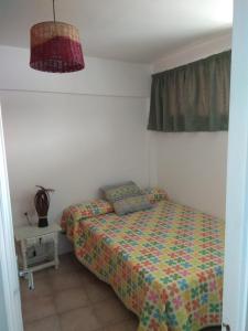 Postel nebo postele na pokoji v ubytování APARTAMENTO ACOGEDOR CON VISTAS AL MAR