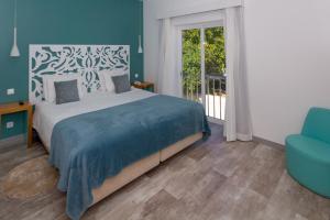 Postel nebo postele na pokoji v ubytování Mareta View - Boutique Bed & Breakfast