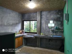 a large bathroom with a sink and a window at Pana and River Homestay Kang Krachan in Kaeng Krachan +159 photos