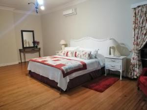 Postel nebo postele na pokoji v ubytování Hostal Viña Malva