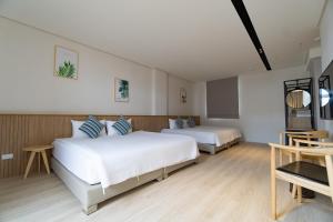 Tempat tidur dalam kamar di Feng-Chi Inn