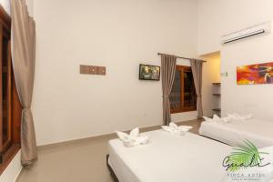 Postel nebo postele na pokoji v ubytování Finca Hotel Guali Santafe
