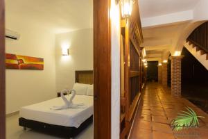 Postel nebo postele na pokoji v ubytování Finca Hotel Guali Santafe
