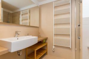 a bathroom with a sink and a shower at Apartments Lux by Locap Group in Portorož +37 photos