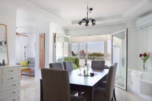 a dining room with a table and chairs at R&E apartment in Torremolinos