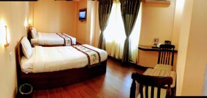 Voodi või voodid majutusasutuse Kathmandu Garden Home toas