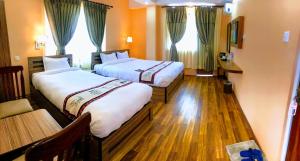 Voodi või voodid majutusasutuse Kathmandu Garden Home toas
