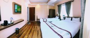 Voodi või voodid majutusasutuse Kathmandu Garden Home toas
