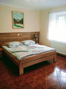 Apartma Bača tesisinde bir odada yatak veya yataklar