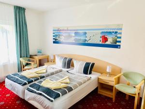 Voodi või voodid majutusasutuse Hotel-Pension "Petridamm" toas