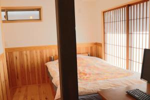 Postel nebo postele na pokoji v ubytování Guest House Ilonggo