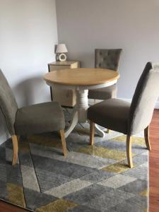 a wooden table and two chairs and a table and chairs at Central Unite management Ltd in Manchester +19 photos
