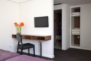 TV a/nebo společenská místnost v ubytování Hotel Regina
